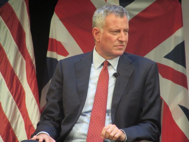Mayor Bill de Blasio listens during a forum alongside London Mayor Sadiq Khan.