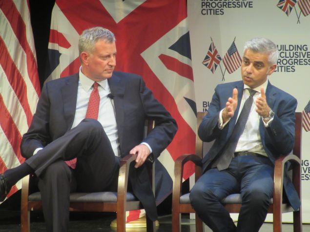 Mayor Bill de Blasio listens as his London counterpart, Sadiq Khan, the city's first Muslim mayor, speaks. 