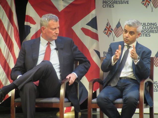Mayor Bill de Blasio listens as his London counterpart, Sadiq Khan, the city's first Muslim mayor, speaks.