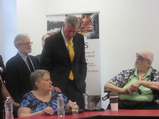 Mayor Bill de Blasio speaks with residents.