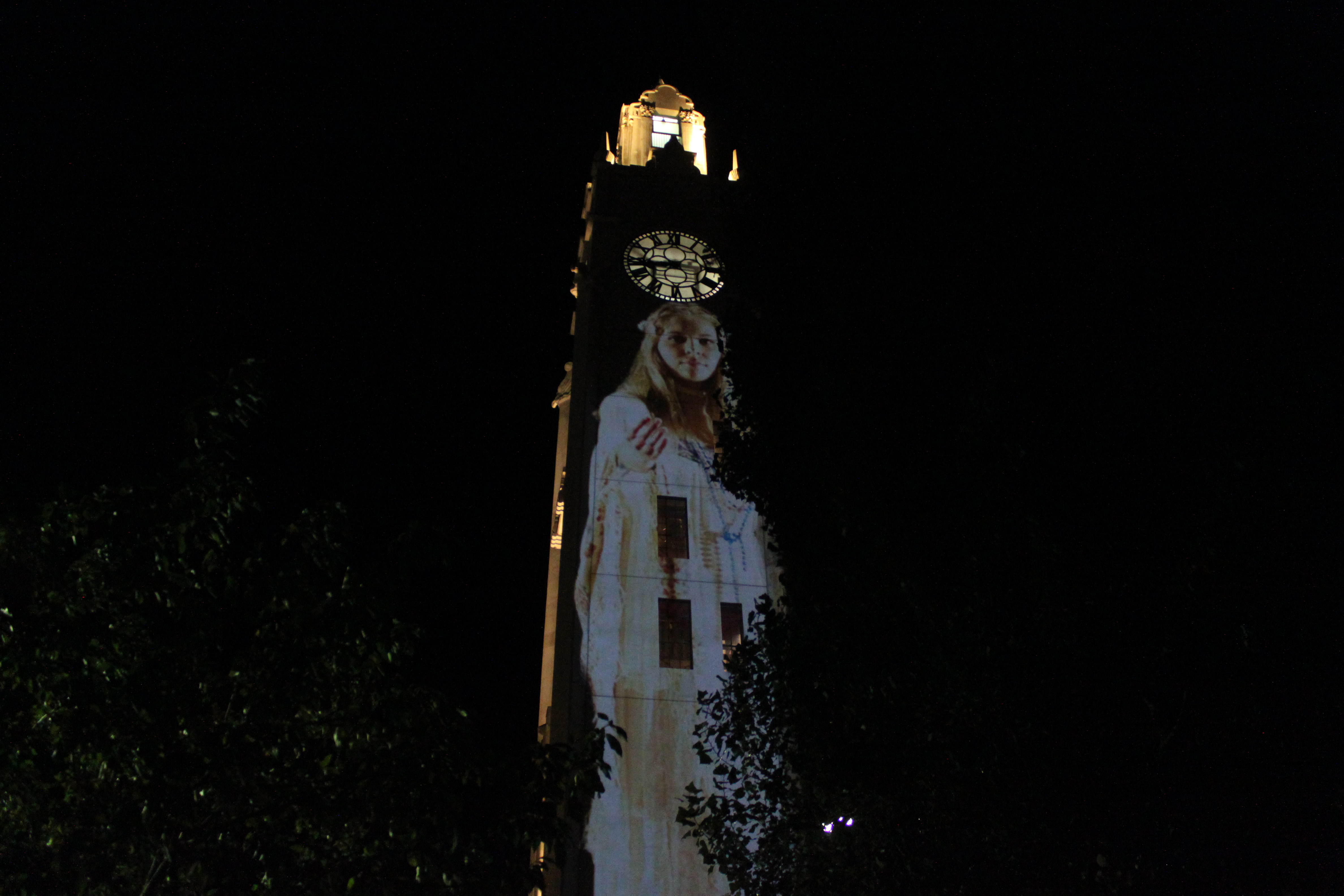 "Suzanne" projected on the clock tower at Montreal's old port.