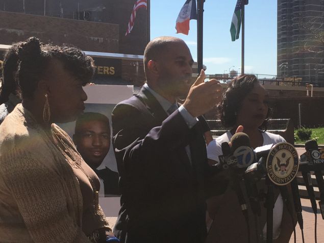 Congressman Hakeem Jeffries, center, flanked by Gwen Carr, left, and Constance Malcolm, right.