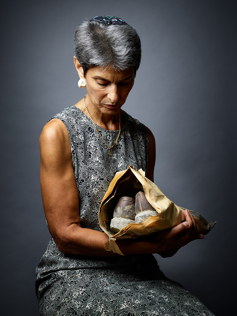 Rabbi Janise Poticha cradles the ash-covered shoes she wore on 9/11.