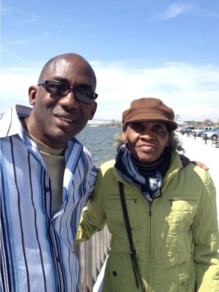 David De Jesus, award-winning ad salesman at the Washington Post, seen here with his mother, has a hearing for his racial discrimination suit on Tuesday.
