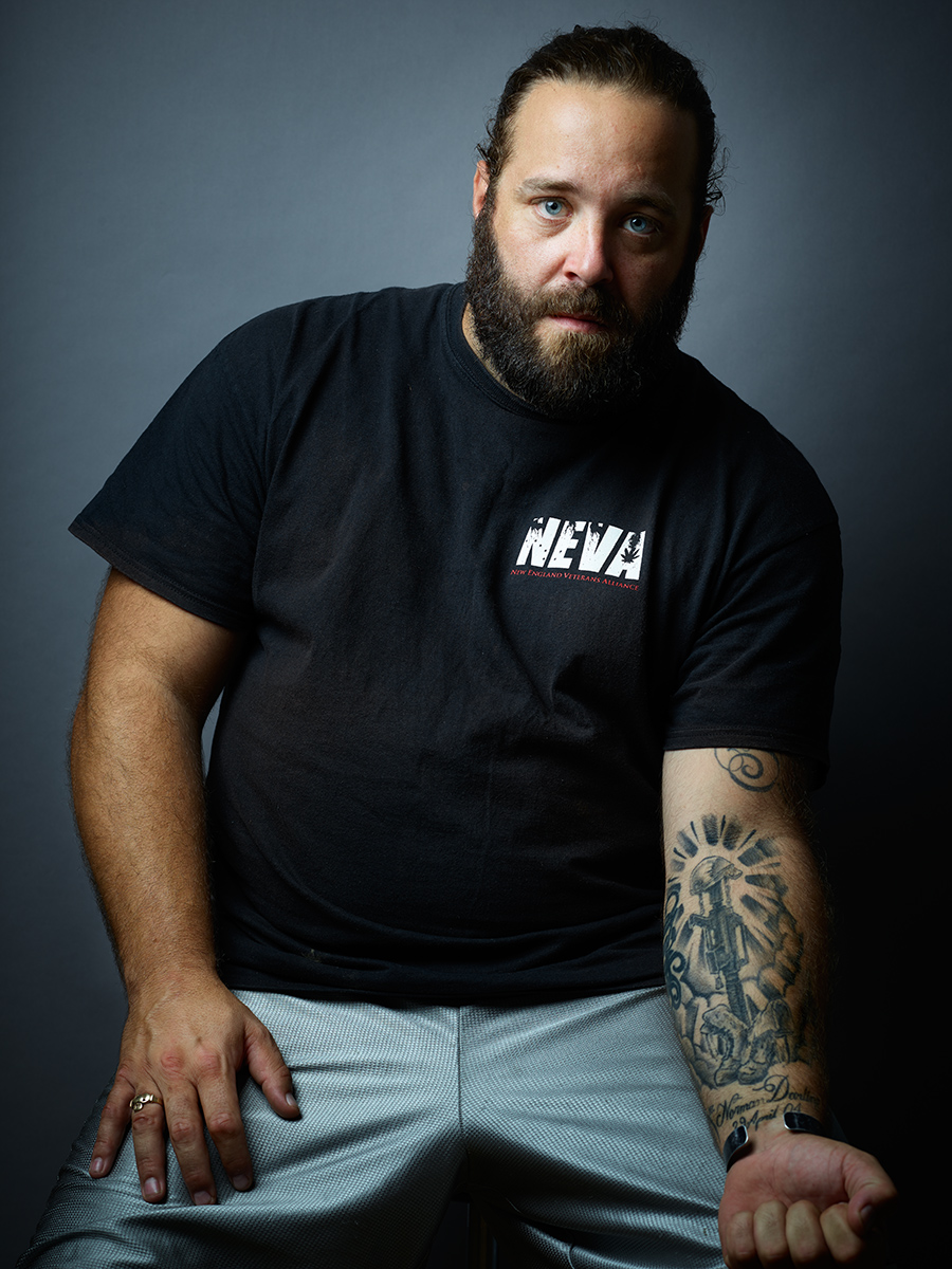 Sean Judge shows off his tattoo, the only thing he has left from his tour of Iraq.