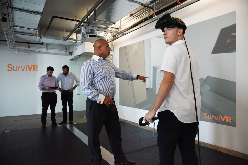 Background: Human Condition Safety Founders, Oliver Rothauser and Peter Raymond. Center: Lorenzo Gallo, CEO of the Safety Group, demonstrating a virtual reality training.