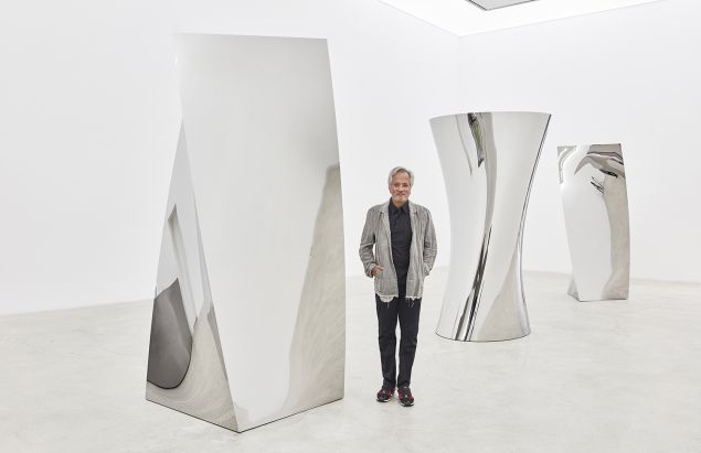 Anish Kapoor among his sculptures in the "Gathering Clouds" show, currently on at Kukje Gallery. 