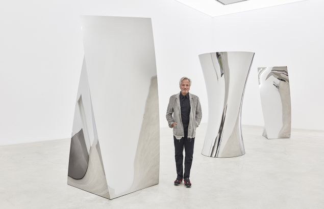 Anish Kapoor among his sculptures in the "Gathering Clouds" show, currently on at Kukje Gallery.