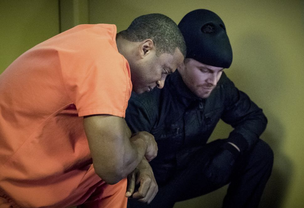 David Ramsey as John Diggle and Stephen Amell as Oliver Queen.