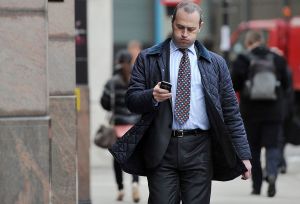 LONDON, ENGLAND - NOVEMBER 07: A man checks his mobile phone on the day that Twitter announced its initial public offering and debut on the New York Stock Exchange on November 7, 2013 in London, England. Twitter went public on the NYSE opening at USD 26 per share, valuing the company's worth at an estimated USD 18 billion. (Photo by Bethany Clarke/Getty Images)