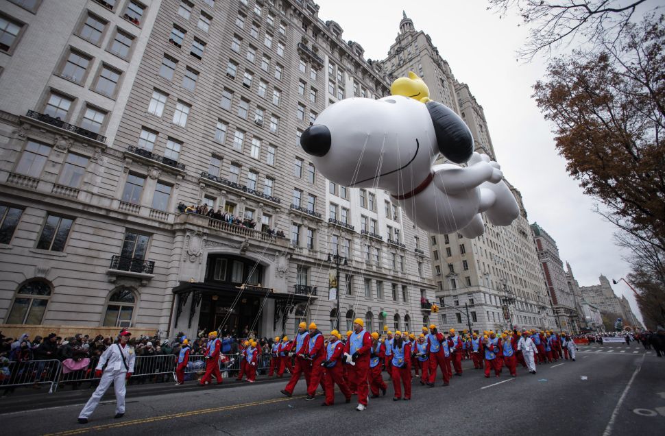 The Snoopy balloon floats down Central Park West during the 88th Annual Macy's Thanksgiving Day Parade in New York on Novemver 27, 2014. The giant balloons, a signature feature of the parade, made their debut in 1927. AFP PHOTO/