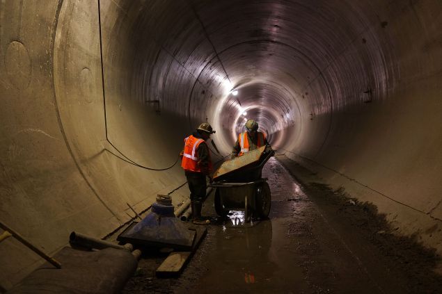 Workers in a tunnel underneath Manhattan at the Second Avenue Subway project site in New York City, in 2014.