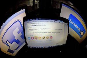 A picture taken on October 9, 2015 in Madrid shows a computer screen displaying the Facebook webpage with the new "Reactions" options as an extension of the "like" button, to give people more ways to easily signal how they feel. Facebook will begin testing this new feature allowing users in Ireland and Spain to express a range of emotions on posts starting today, but there will be no "dislike" button, the social network said. AFP PHOTO / GERARD JULIEN (Photo credit should read GERARD JULIEN/AFP/Getty Images)
