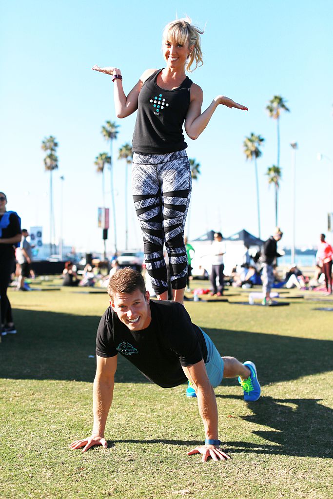 SAN DIEGO, CA - NOVEMBER 14: Fitbit Local Ambassadors Sheri Matthews and Mike Sherbakov stand ready before leading Fitbit introduces Fitbit Local, free all-levels workouts led by talented community trainers. The launch in San Diego included a morning bootcamp and yoga session led by Sheri Matthews and Mike Sherbakov. Get Together. Sweat Together. (Photo by Robert Benson/Getty Images for Fitbit)