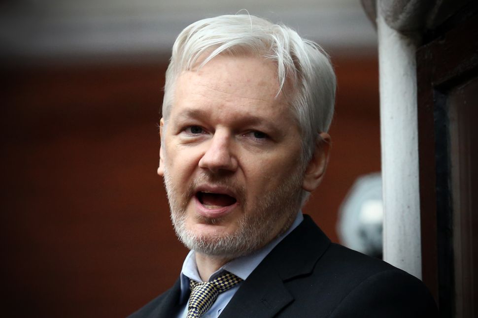 WikiLeaks founder Julian Assange speaks from the balcony of the Ecuadorian embassy where he continues to seek asylum following an extradition request from Sweden in 2012, on February 5, 2016 in London, England