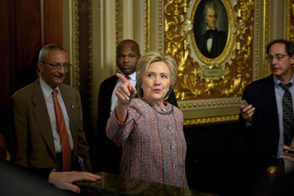 US Democratic presidetial candidate Hillary Clinton leaves with Campaign Manager John Podesta (L) after a meeting with Senate Democrats on Capitol Hill July 14, 2016 in Washington, DC.