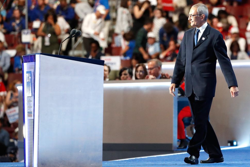 John Podesta, chair of the Hillary Clinton presidential campaign, walks on stage to deliver a speech on the first day of the Democratic National Convention at the Wells Fargo Center, July 25, 2016 in Philadelphia, Pennsylvania.