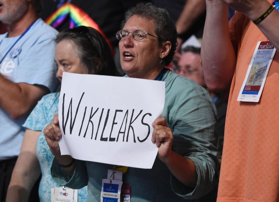 A woman holds up a sign referencing Wikileaks during Day 2 of the Democratic National Convention at the Wells Fargo Center in Philadelphia, Pennsylvania, July 26, 2016.