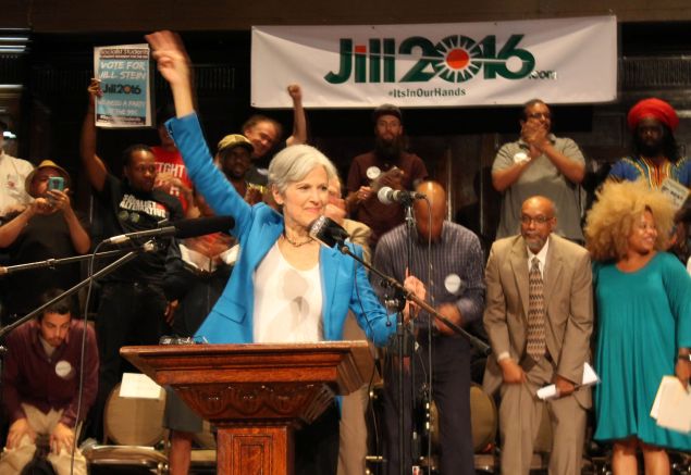 Green Party candidate Jill Stein waves a peace sign after discussing her active arrest warrant in North Dakota at a rally on September 8, 2016 in Chicago