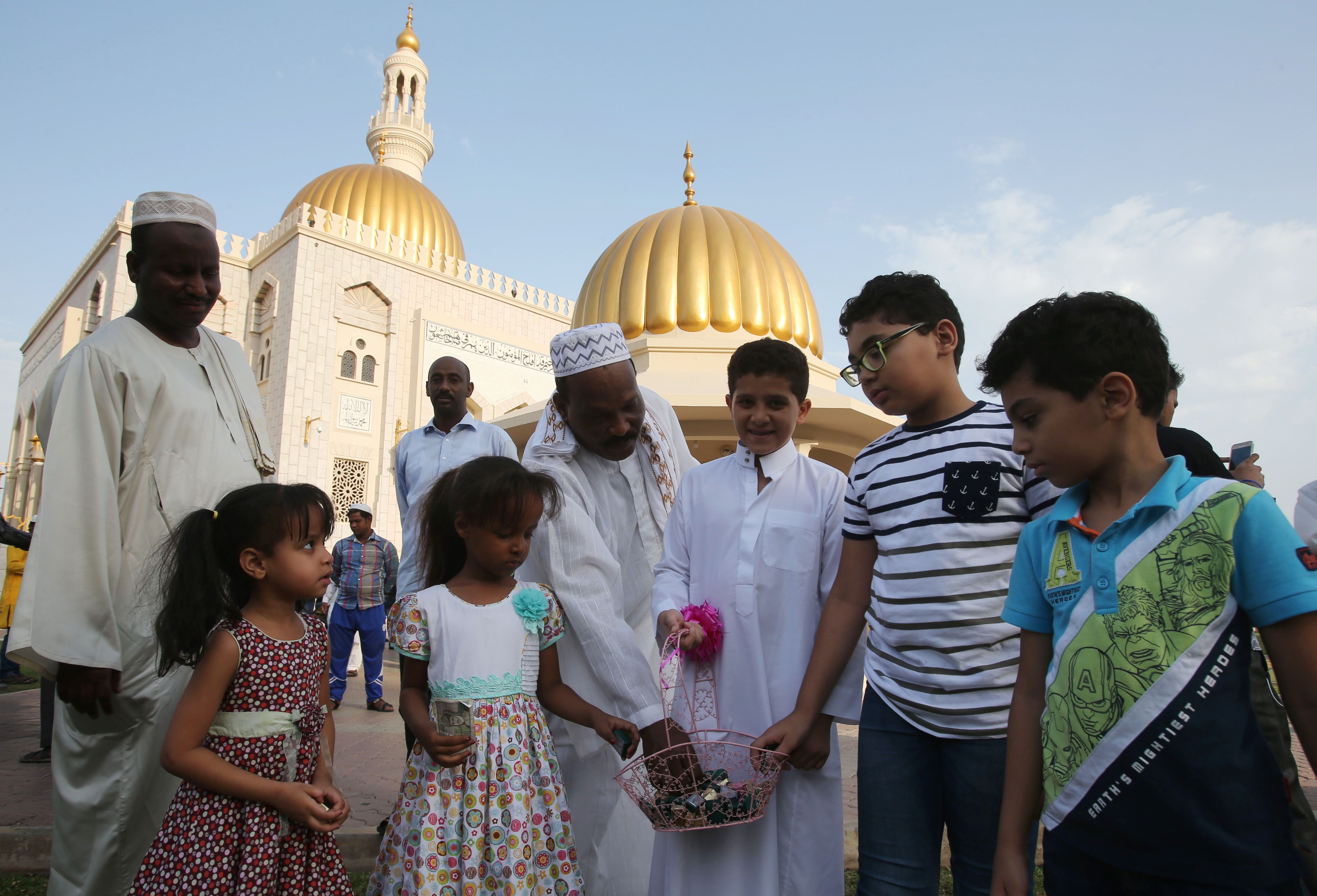 Muslim children outside a mosque in the Omani capital Muscat