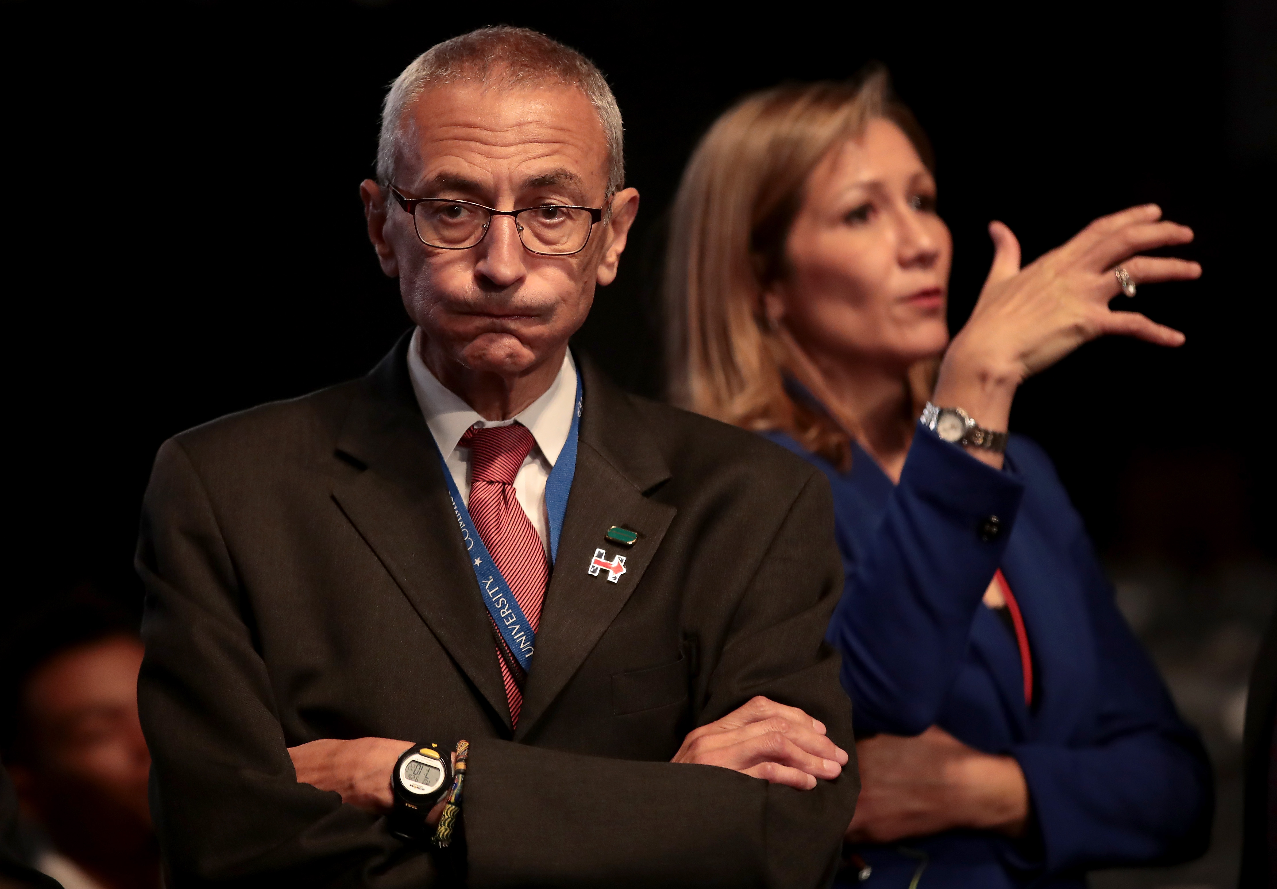 Democratic presidential nominee Hillary Clinton's Campaign Chairman John Podesta (L) looks on prior to the start of the Presidential Debate at Hofstra University on September 26, 2016 in Hempstead, New York. 