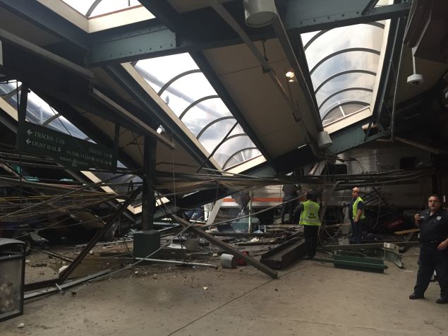 A NJ Transit train seen through the wreckage after it crashed in to the platform at the Hoboken Terminal September 29, 2016 in Hoboken, New Jersey. 