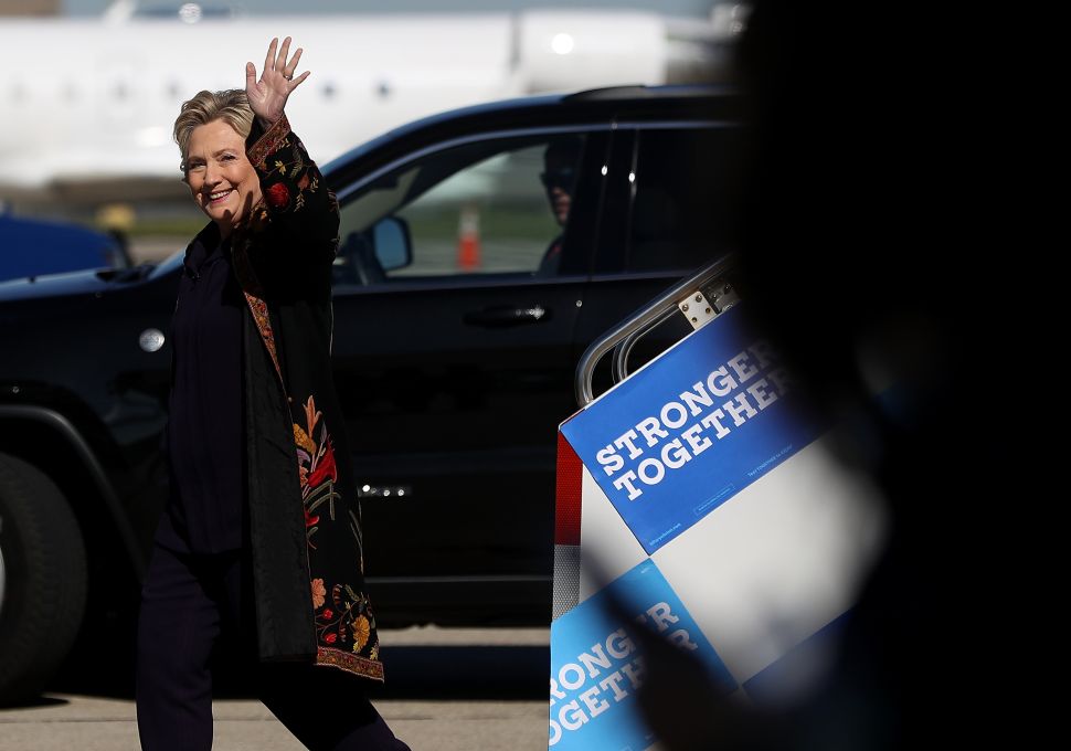 Democratic presidential nominee former Secretary of State Hillary Clinton arrives at Detroit Metropolitan Wayne County Airport on October 10, 2016 in Detroit, Michigan. A day after the second presidential debate in St. Louis, Hillary Clinton is campaigning in Michigan and Ohio.