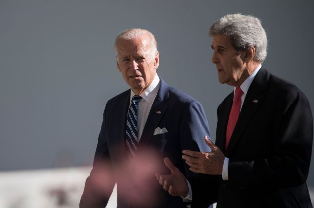 US Vice President Joe Biden (L) speaks with US Secretary of State John Kerry as they walk the colonnade at the White House in Washington, DC, October 18, 2016. 