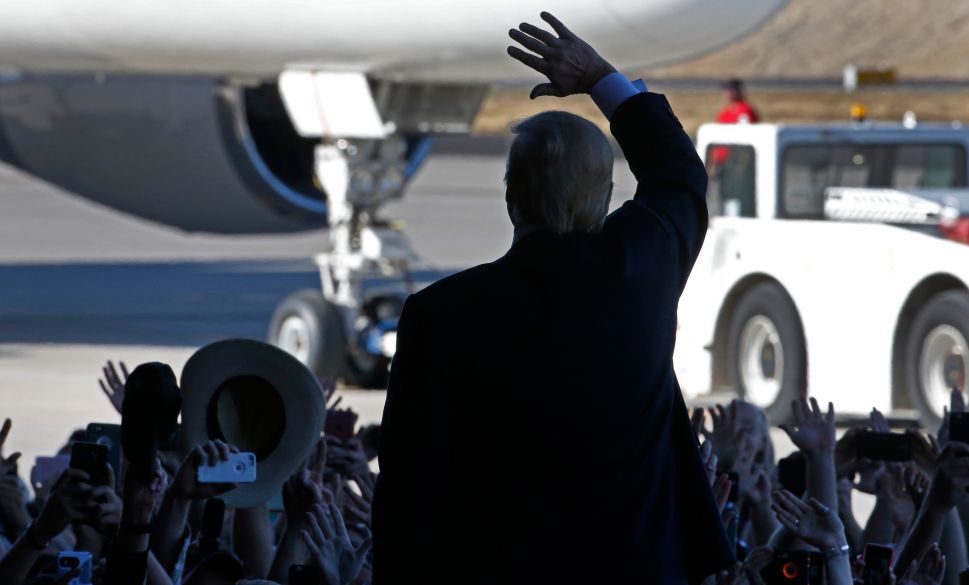 GRAND JUNCTION, CO - OCTOBER 18: Republican presidential candidate Donald Trump waves as he leaves a rally at Grand Junction Regional Airport on October 18, 2016 in Grand Junction Colorado. Trump is on his way to Las Vegas for the third and final presidential debate against Democratic rival Hillary Clinton.