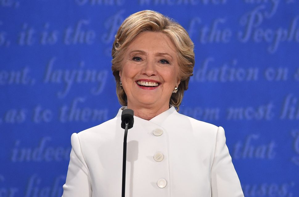 Democratic nominee Hillary Clinton smiles during the final presidential debate at the Thomas & Mack Center on the campus of the University of Las Vegas in Las Vegas, Nevada on October 19, 2016. / AFP / Robyn Beck