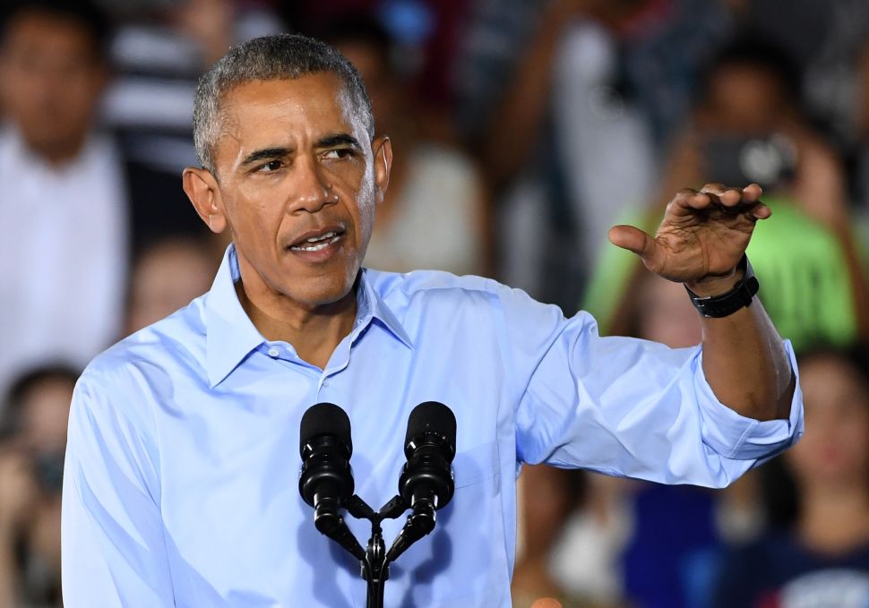 U.S. President Barack Obama speaks during a campaign rally for Democratic presidential nominee Hillary Clinton at Cheyenne High School on October 23, 2016 in North Las Vegas, Nevada. Obama urged Nevadans to vote early one day after a record-breaking start to early voting in the swing state with almost 40,000 people going to the polls ahead of the November 8 general election.