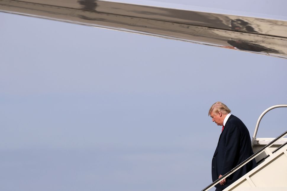 ROMULUS, MI - OCTOBER 31:  Republican presidential nominee Donald Trump steps off of his airplane at Detroit Metropolitan Wayne County Airport before heading to a campaign rally in Warren October 31, 2016 in Romulus, Michigan. With just eight days until the election, polls show a slight tightening in the race.