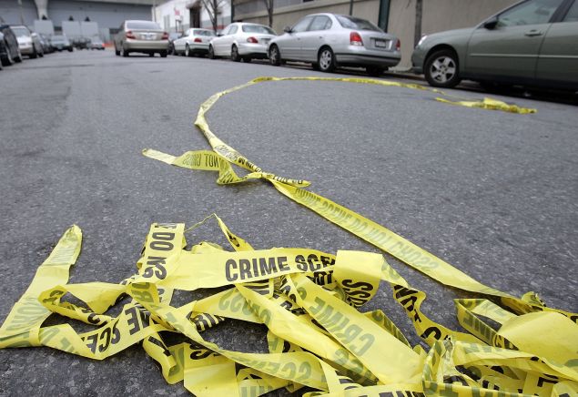 Police crime scene tape lies in the street outside Club Kalua club where Sean Bell was shot and killed November 28, 2006 in Jamaica, Queens, New York City.