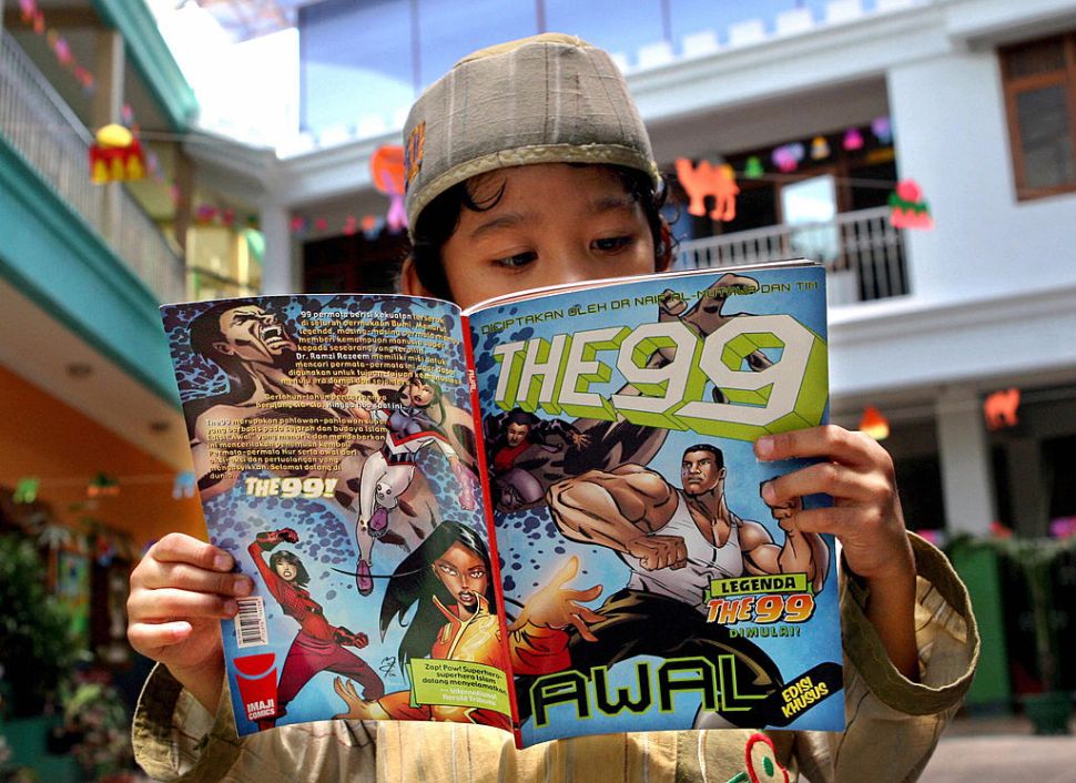COMIC by Nabiha Shahab A young boy reads a copy of the "The 99" comic book at his school in Jakarta, 01 October 2007. Jabbar the Powerful, the alter-ego of teenager Nawaf Al-Bilali, is the first of 99 superhero characters in an Islamic culture-based comic book series, "The 99", launched this month in Indonesia. The comic seeks to act as a metaphor for what's happening in the Islamic world, its creator, Kuwaiti-born Naif Al-Mutawa, told Agence France Presse (AFP). AFP PHOTO/ADEK BERRY