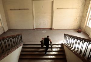 TBLISI, GEORGIA - AUGUST 15: A Georgian man carries up a cot donated by the U.S. government that arrived in recent days at their shelter in an old ministry building August 15, 2008 in Tbilisi, Georgia. Tens of thousands of Georgians and others have fled the areas of north Georgia affected by the stand off with Russian forces, and hundreds of them are taking shelter in this building, and old Communist-era ministry that's now housing desperate Georgians who fled their homes.
