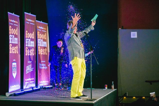 Festival director George Motz revels in confetti on opening night.