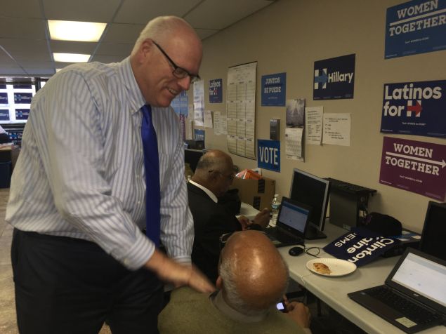 Congressman Joseph Crowley talks with a phone banker.
