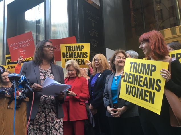 Public Advocate Letitia James protests in front of Trump Tower with other female elected officials and advocates.