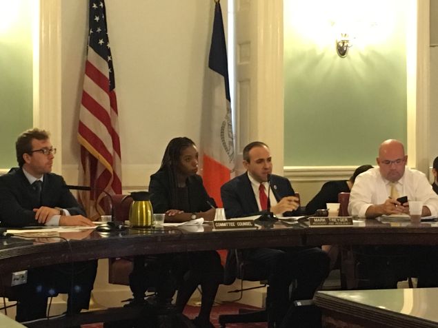 Councilman Mark Treyger, center, and Councilman Steven Matteo, right, listen to testimony from Mayor de Blasio's administration about the Build It Back program.