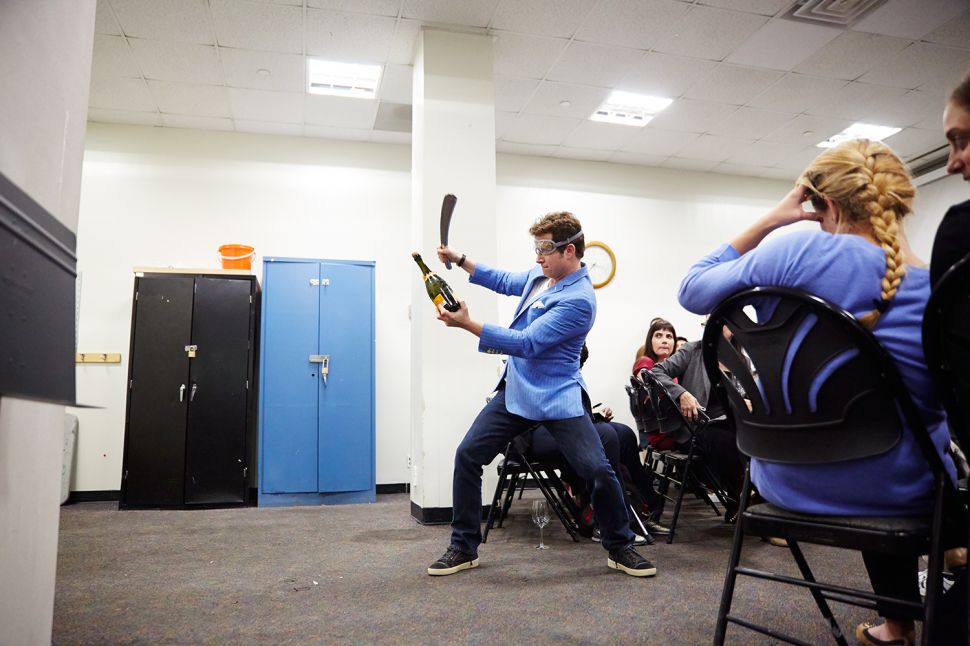 Mark Oldman gets ready to decapitate a a bottle during his "How to Drink Like a Billionaire" wine-tasting class at the 92nd St. Y.
