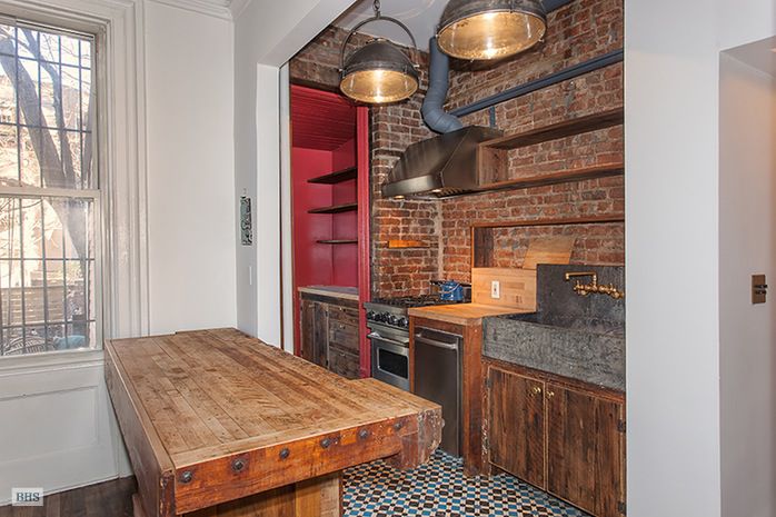 Kitchen with butcher-block counters.