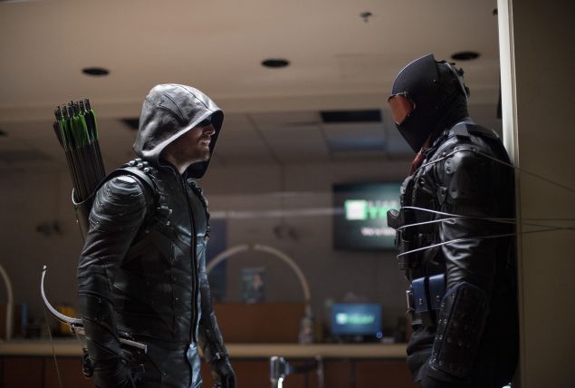 Stephen Amell as The Green Arrow and Vigilante.