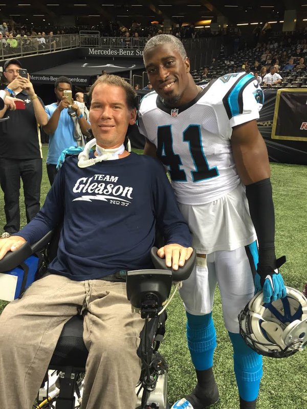 Former New Orleans Saints safety Steve Gleason, who has ALS, with Saints strong safety Roman Harper.