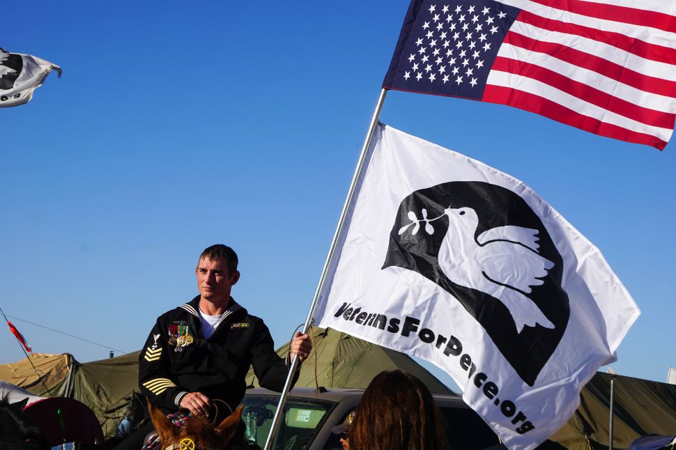 First Class Petty Officer Kash Jackson donned his dress blues on horseback in solidarity with #NoDAPL, to protest the Dakota Access Pipleline