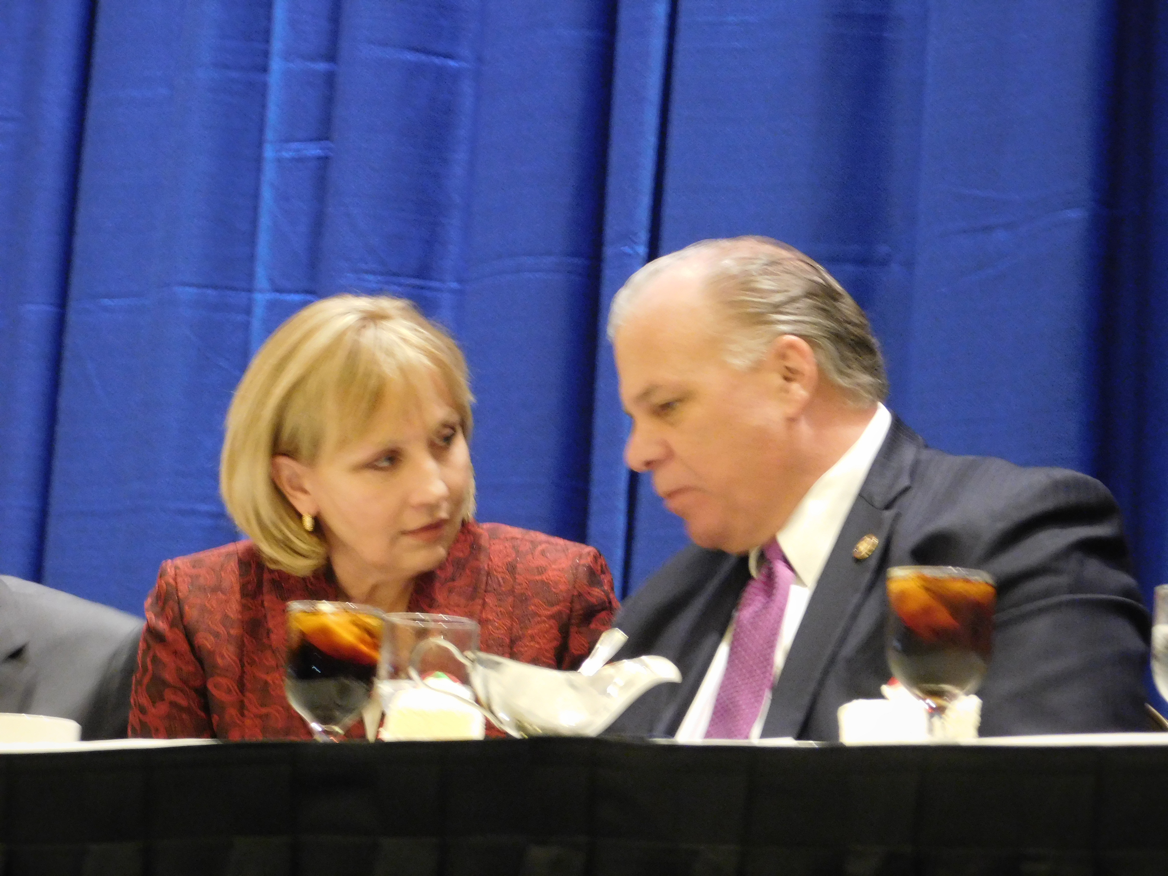 Guadagno and Senate President Steve Sweeney sit at the head table during Christie's speech.