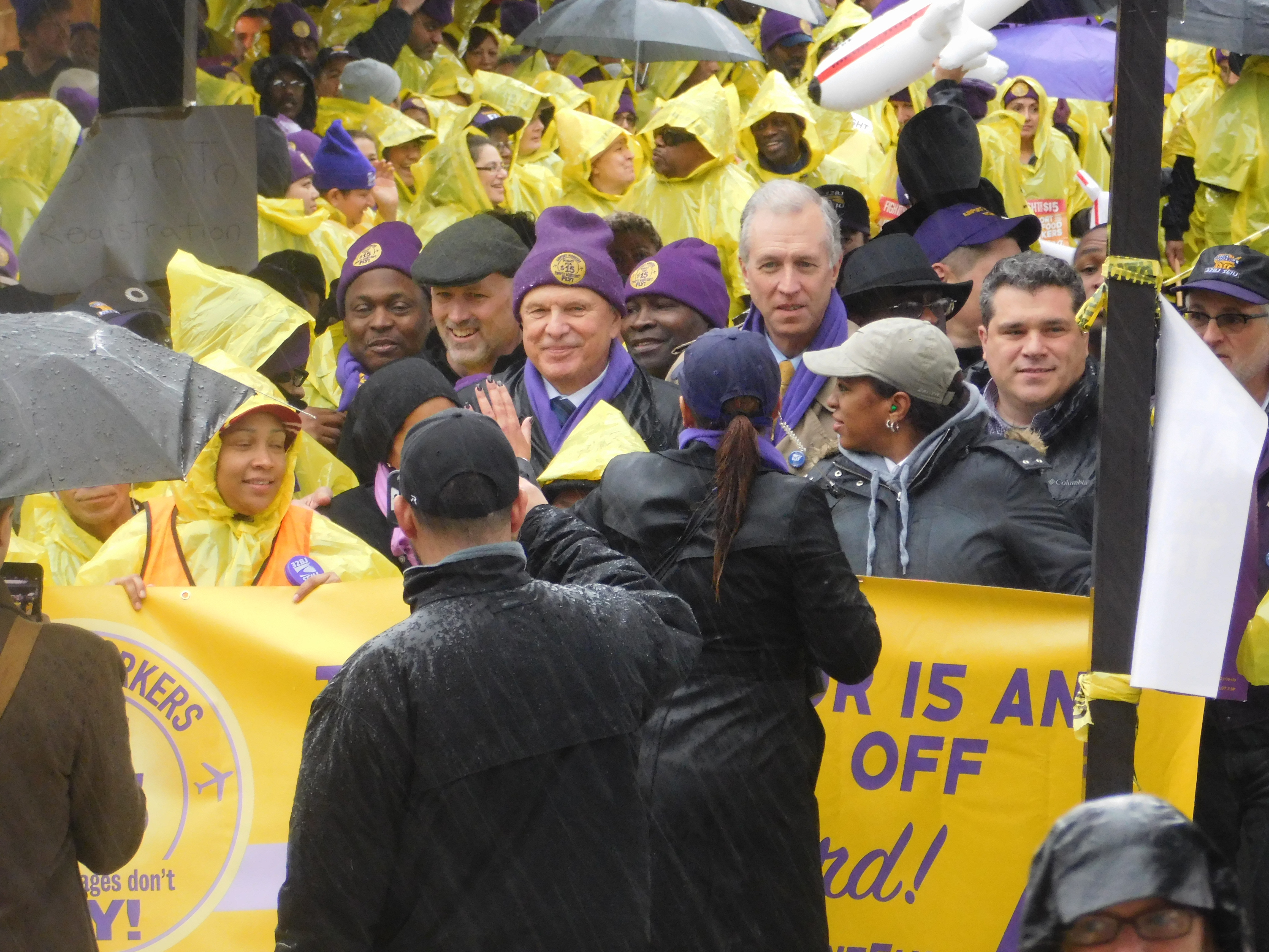 State Senator Ray Lesniak and Assemblyman John Wisniewski can be seen among those gathered outside of Newark Airport's terminal B.