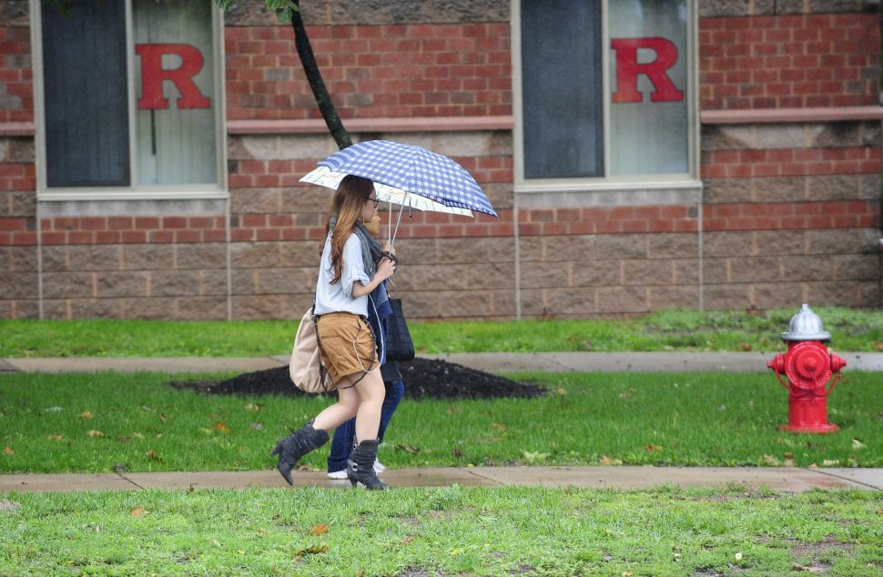 A student walks past the dormitory at Rutgers Univeristy in New Brunswick, New Jersey on October 01, 2010 where first-year student Tyler Clementi, 18, lived and was allegedly filmed and broadcast over the Internet during a gay encounter. Clementi killed himself shortly after being spied on. Two undergraduates have been arrested after the fellow student they allegedly filmed and broadcast over the Internet leapt to his death from a New York bridge. Prosecutors said that two students at Rutgers had been charged with invasion of privacy and that investigators were considering further charges linked to the fact that Clementi was apparently filmed in a homosexual act. AFP