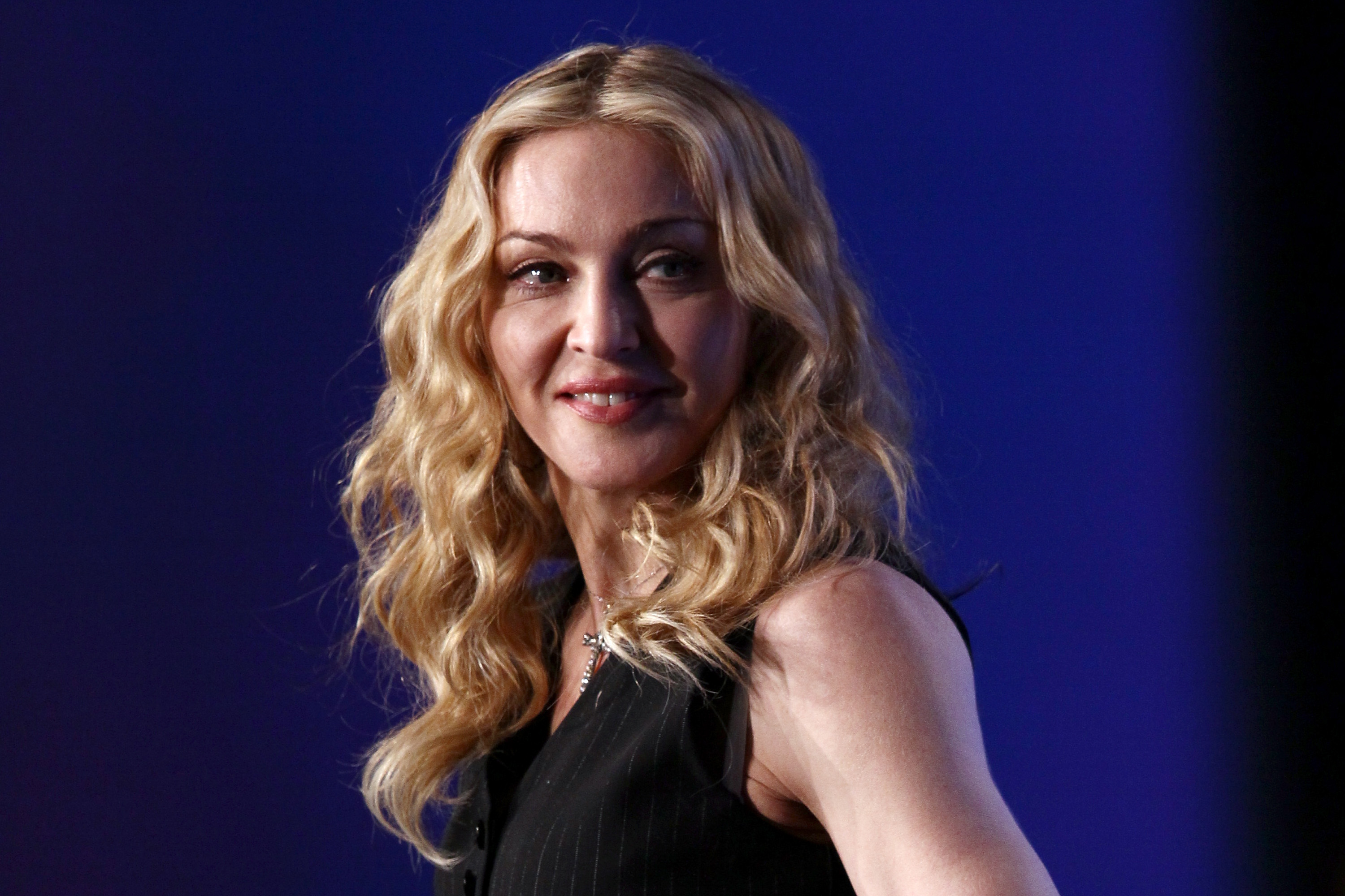 INDIANAPOLIS, IN - FEBRUARY 02: Singer Madonna looks on on during a press conference for the Bridgestone Super Bowl XLVI halftime show at the Super Bowl XLVI Media Center in the J.W. Marriott Indianapolis on February 2, 2012 in Indianapolis, Indiana.