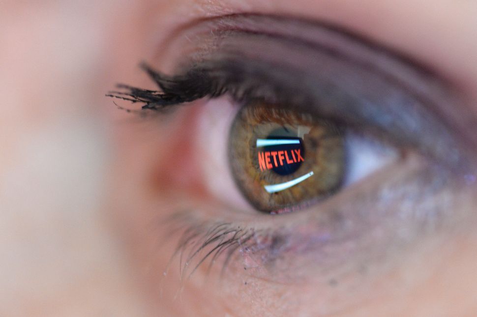 PARIS, FRANCE - SEPTEMBER 19: In this photo illustration the Netflix logo is reflected in the eye of a woman on September 19, 2014 in Paris, France. Netflix September 15 launched service in France, the first of six European countries planned in the coming months. 