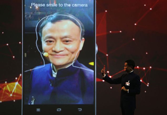 Alibaba's Jack Ma presents on his company's use of facial recognition for payments in Hanover, Germany.